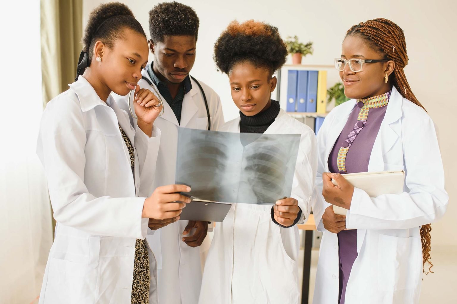 group-of-medical-doctors-in-office-with-patient-s-VLL9JJ6-1536x1024