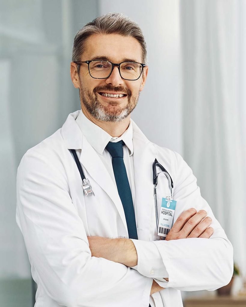 healthcare-smile-and-portrait-of-doctor-man-in-h-FQW3ASA-819x1024