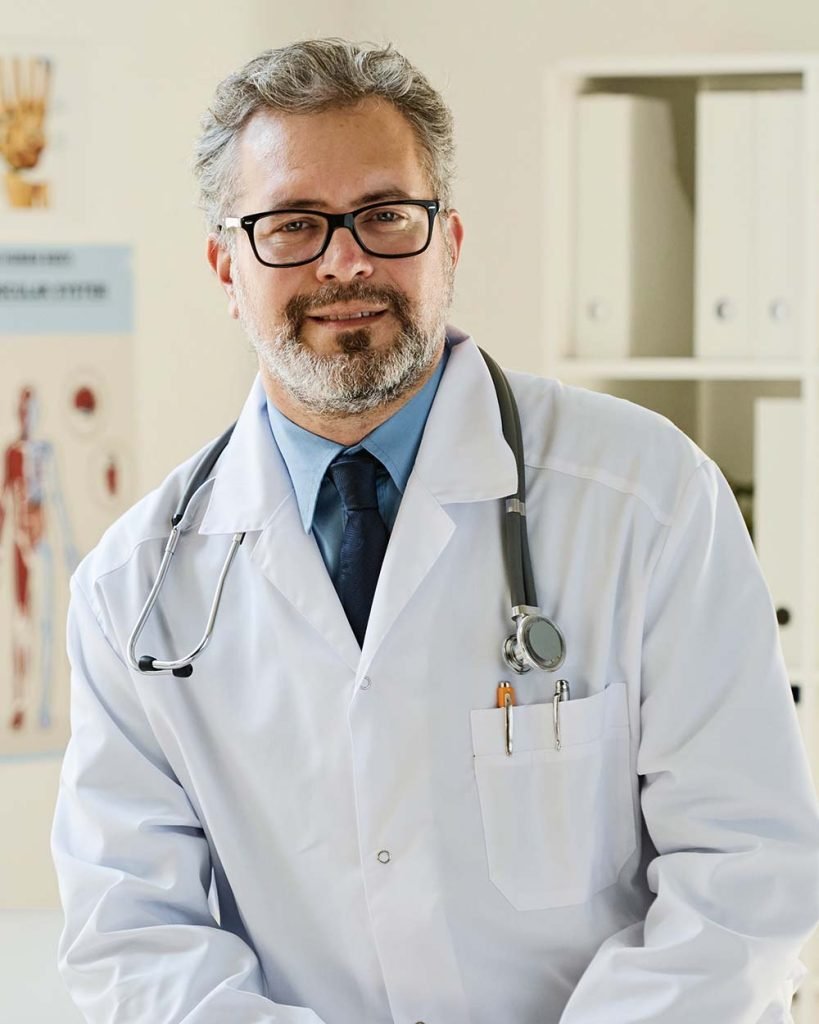 professional-doctor-working-at-office-GFTJSJR-819x1024