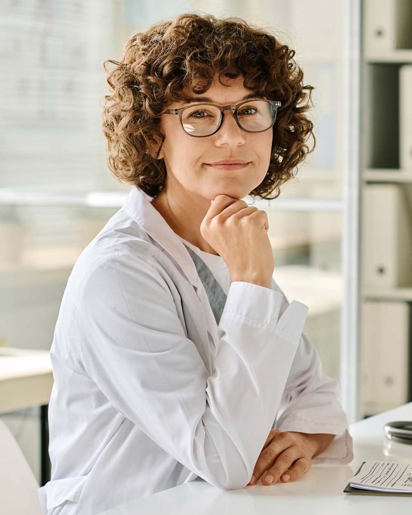 professional-pediatrician-sitting-at-her-workplace-U5FD8MH-819x1024